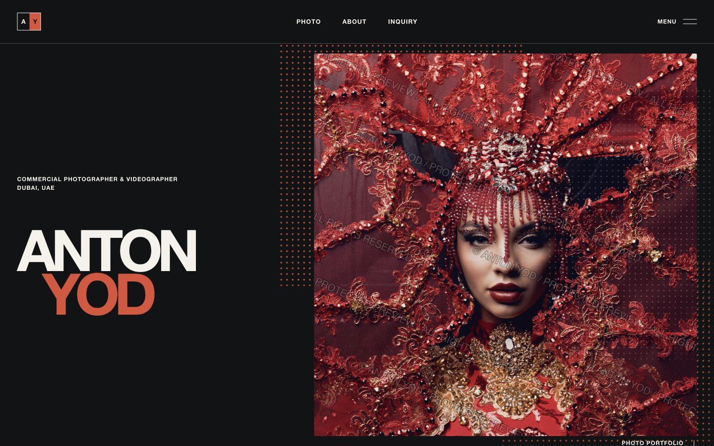 YODPHOTO live homepage with an Anton Yod title, dark editorial navigation and a large red fashion portrait.